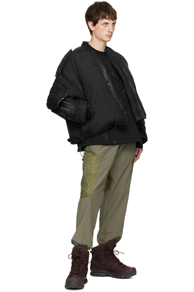 Polyurethane-coated polyester fleece sweatshirt. Piping throughout. 

· Rib knit crewneck and cuffs
· Bungee-style drawstring at hem 

Supplier color: Black