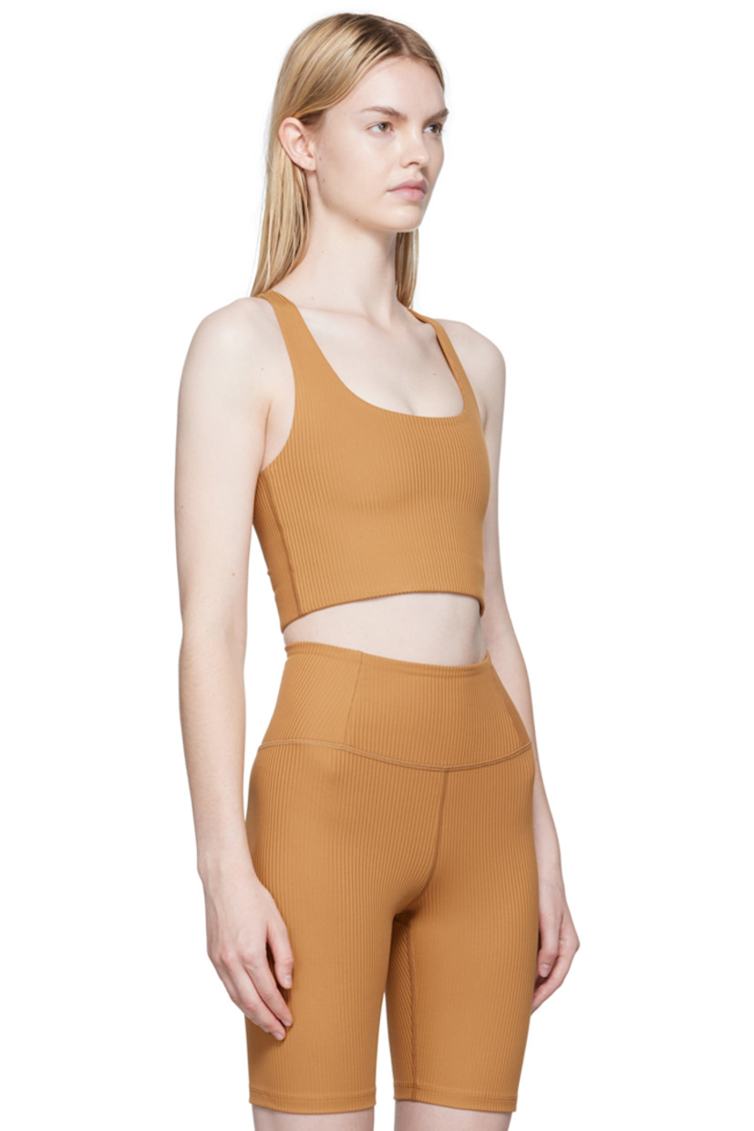 Stretch rib knit recycled polyester sport bra.

· Scoop neck
· Racerback 
· Elasticized hem
· Full jersey lining

Supplier color: Toffee