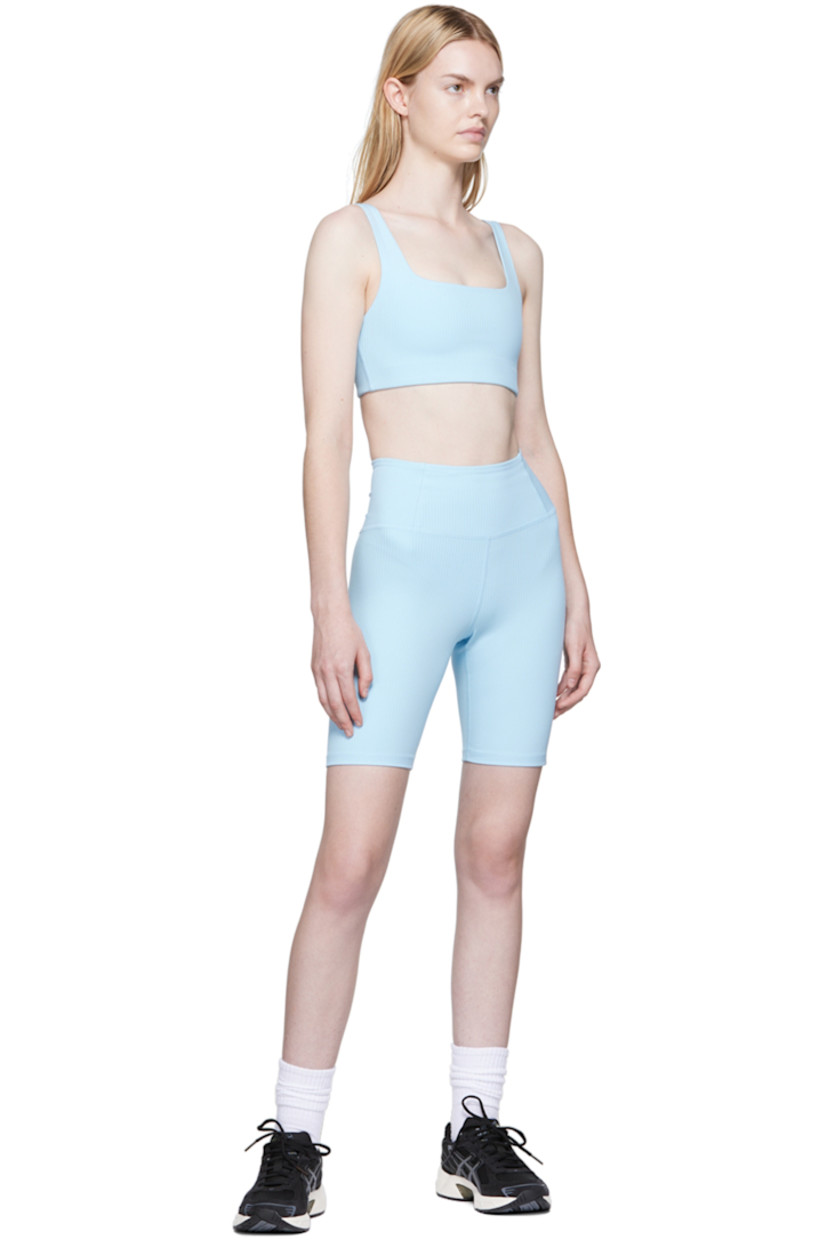 Rib knit stretch recycled polyester sport shorts. 

· High-rise 
· Elasticized waistband
· Concealed welt pocket at back waistband
· Partial jersey lining

Supplier color: Bluebell