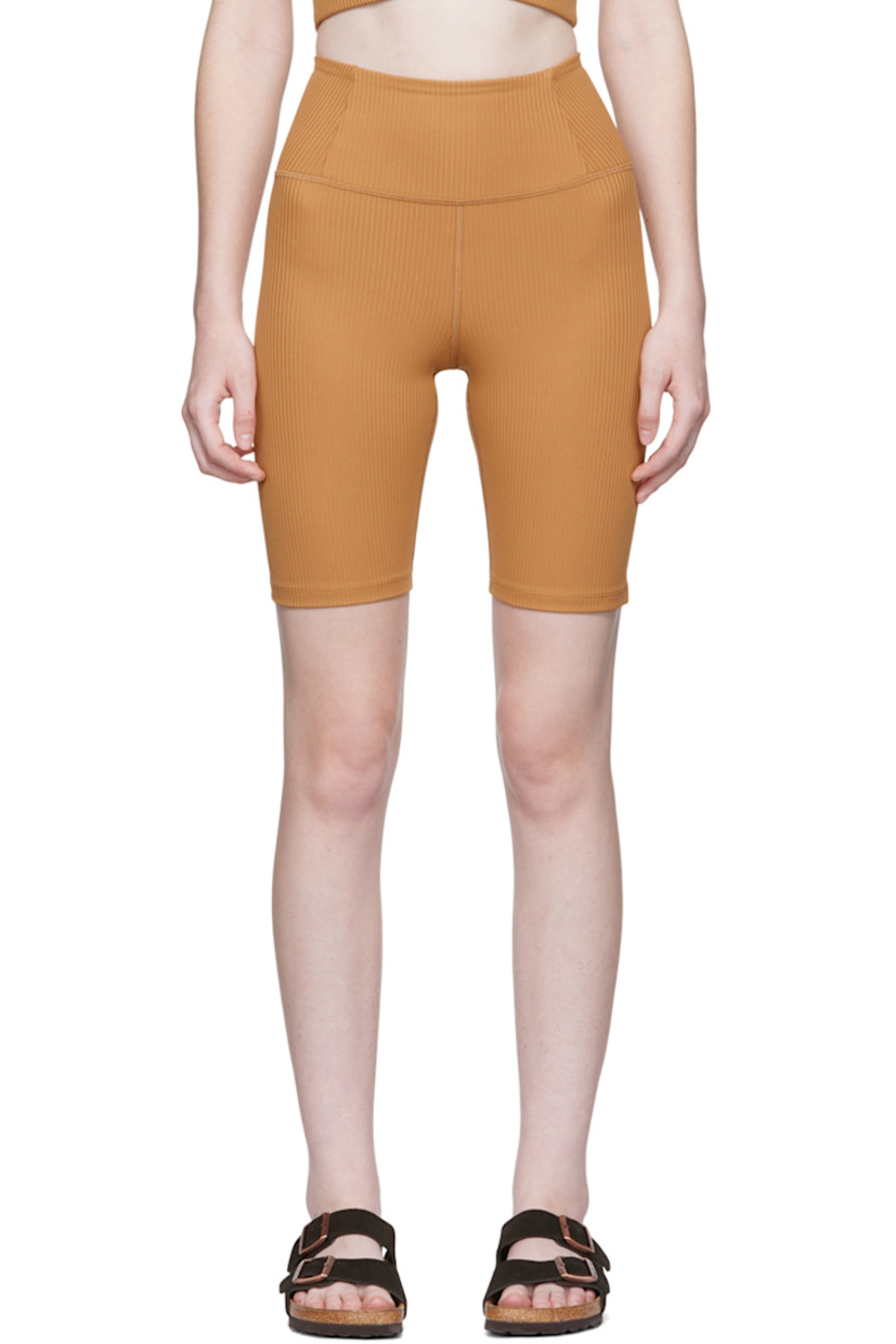 Rib knit stretch recycled polyester sport shorts. 

· High-rise 
· Elasticized waistband
· Concealed welt pocket at back waistband
· Partial jersey lining

Supplier color: Toffee
