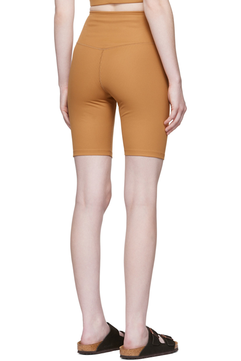Rib knit stretch recycled polyester sport shorts. 

· High-rise 
· Elasticized waistband
· Concealed welt pocket at back waistband
· Partial jersey lining

Supplier color: Toffee
