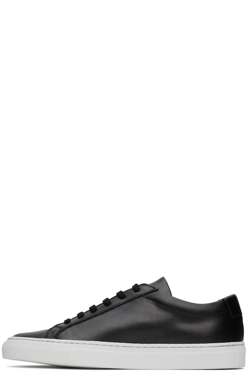 Low-top buffed leather sneakers in black. 

· Lace-up closure
· Padded tongue and collar
· Text printed in gold-tone at outer side
· Treaded rubber sole

Supplier color: Black