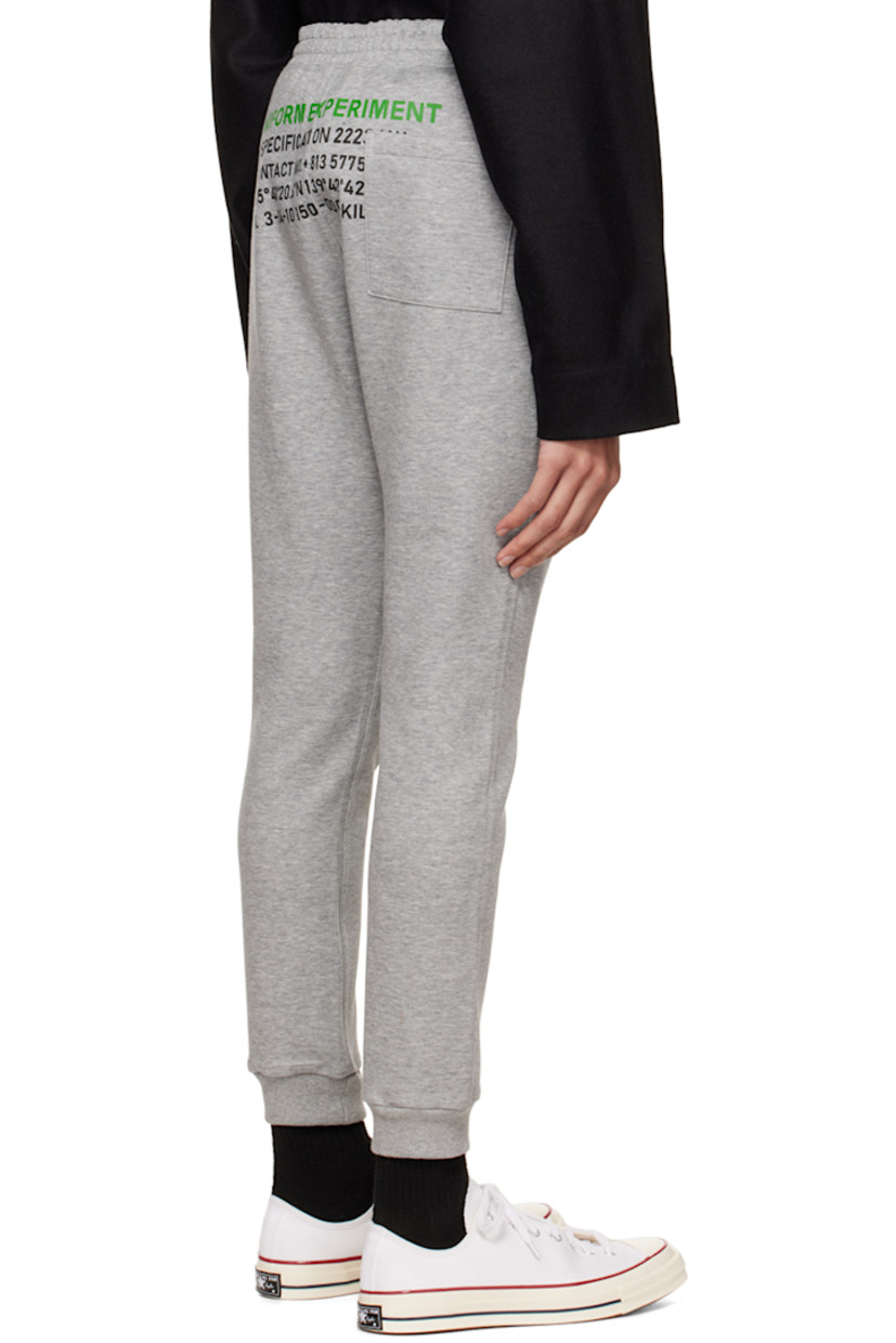 Cotton and polyester-blend jersey lounge pants.

· Logo-engraved D-ring hardware at elasticized waistband
· Three-pocket styling
· Logo printed at front
· Rib knit elasticized cuffs
· Text printed at back 

Supplier color: Gray