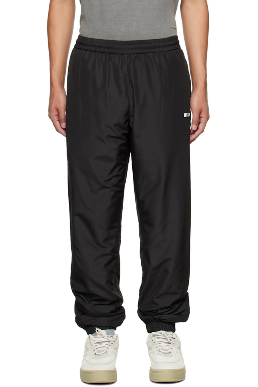 Polyester taffeta lounge pants.

· Concealed drawstring at elasticized waistband
· Three-pocket-styling
· Logo bonded at front
· Zip vents at elasticized cuffs
· Full cotton jersey lining

Supplier color: Black