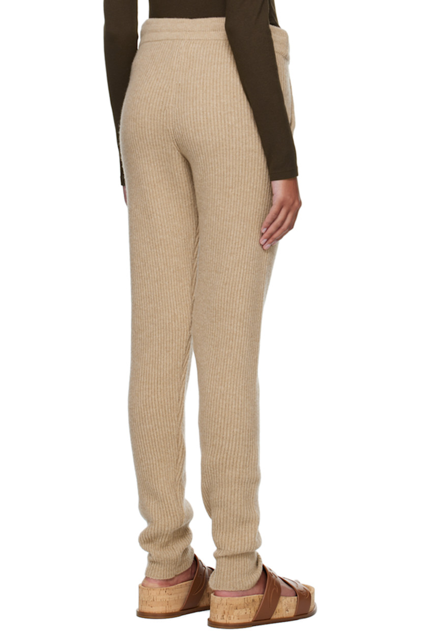 Rib knit recycled wool lounge pants.

· Drawstring at elasticized waistband
· Two-pocket styling

Supplier color: Beaver