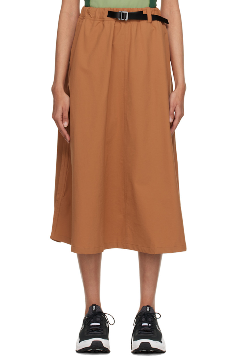 Stretch recycled nylon sport skirt. Moisture-wicking and water-repellent. 

· Integrated press-release belt at elasticized waistband 
· Two-pocket styling 
· Logo printed at front 
· Bungee-style drawstrings at side-seams 
· Locker loop at back waistband 

Supplier color: Brown sugar