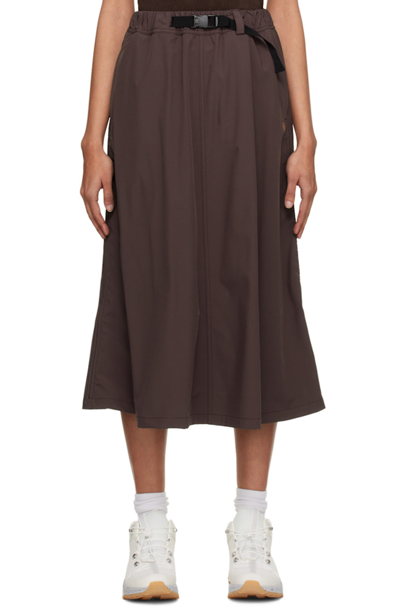 Water-repellant and quick-drying stretch nylon taffeta sport skirt. 

· Integrated press-release belt at elasticized waistband 
· Two-pocket styling 
· Logo printed at front 
· Bungee-style drawstring at hem 
· Locker loop at back waistband

Available exclusively at SSENSE.

Supplier color: Fudge