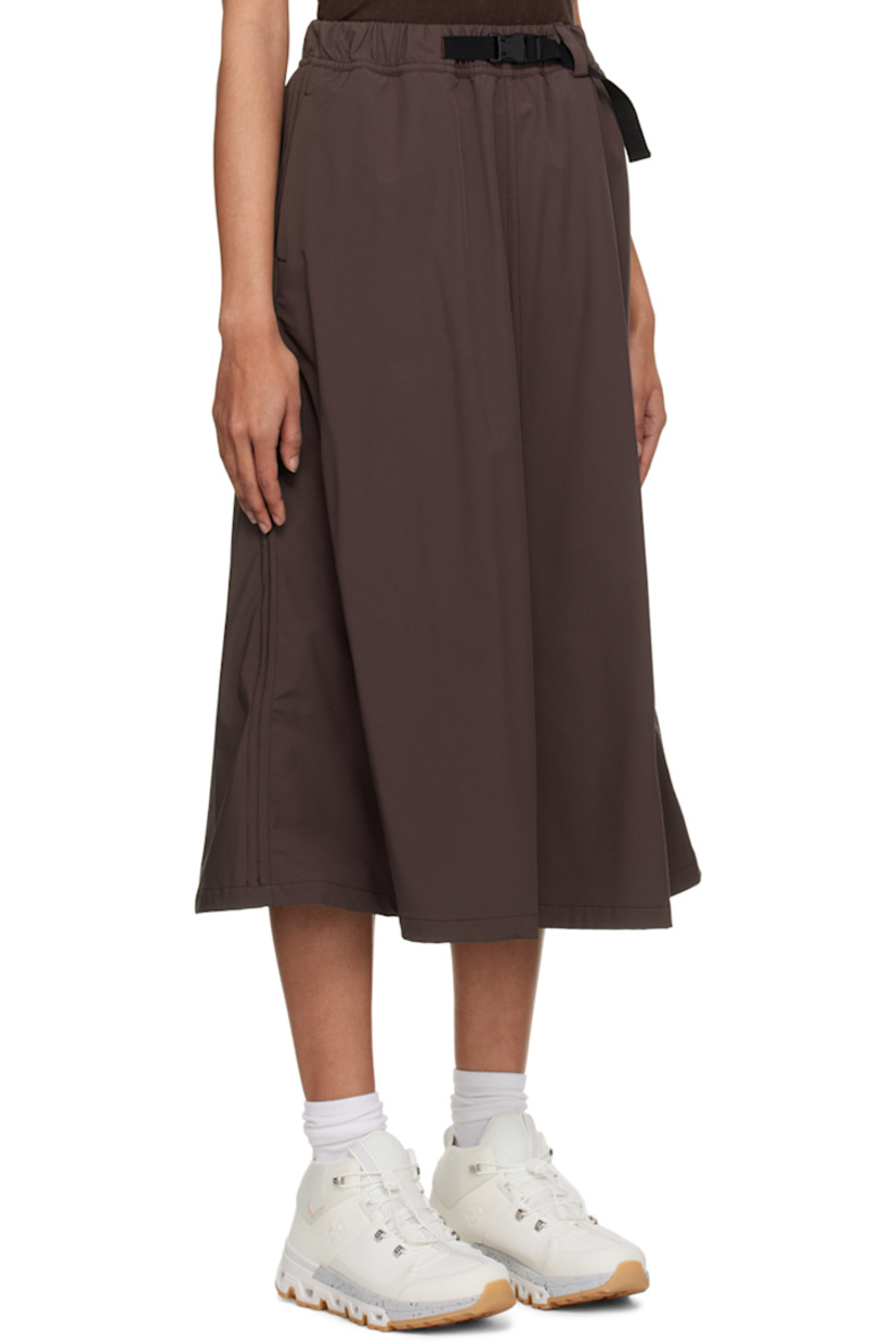 Water-repellant and quick-drying stretch nylon taffeta sport skirt. 

· Integrated press-release belt at elasticized waistband 
· Two-pocket styling 
· Logo printed at front 
· Bungee-style drawstring at hem 
· Locker loop at back waistband

Available exclusively at SSENSE.

Supplier color: Fudge