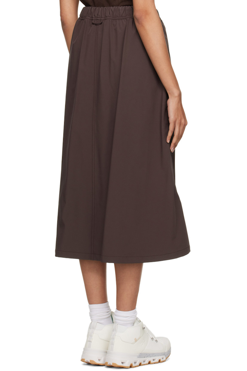 Water-repellant and quick-drying stretch nylon taffeta sport skirt. 

· Integrated press-release belt at elasticized waistband 
· Two-pocket styling 
· Logo printed at front 
· Bungee-style drawstring at hem 
· Locker loop at back waistband

Available exclusively at SSENSE.

Supplier color: Fudge