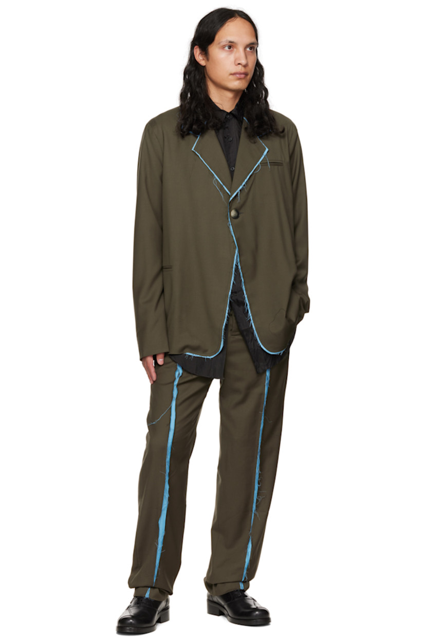 Virgin wool twill trousers. Raw edges throughout. 

· Paneled construction 
· Belt loops
· Four-pocket styling
· Button-fly
· Partial satin lining

Supplier color: Green/Blue