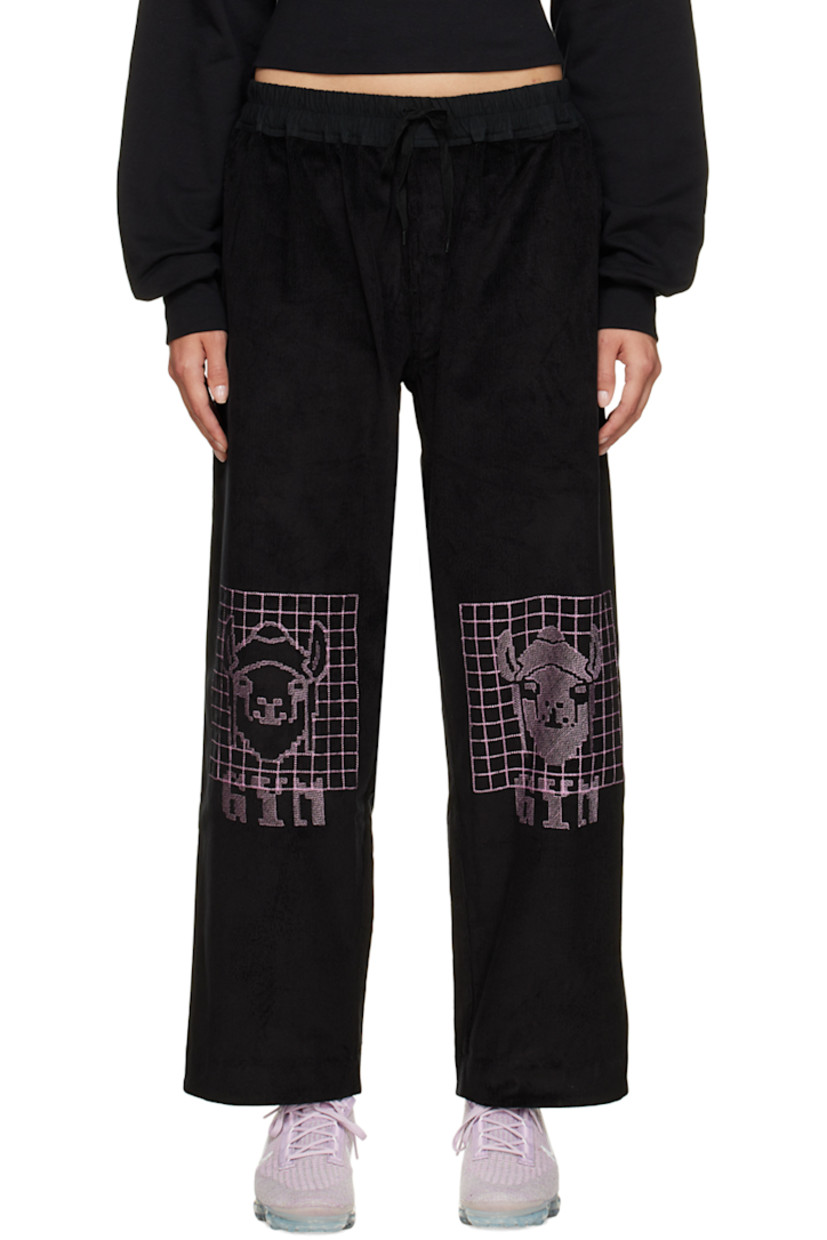 Wide-leg stretch cotton corduroy lounge pants. 

· Drawstring at elasticized waistband
· Three-pocket stylng
· Button-fly
· Graphics embroidered at front

Supplier color: Black