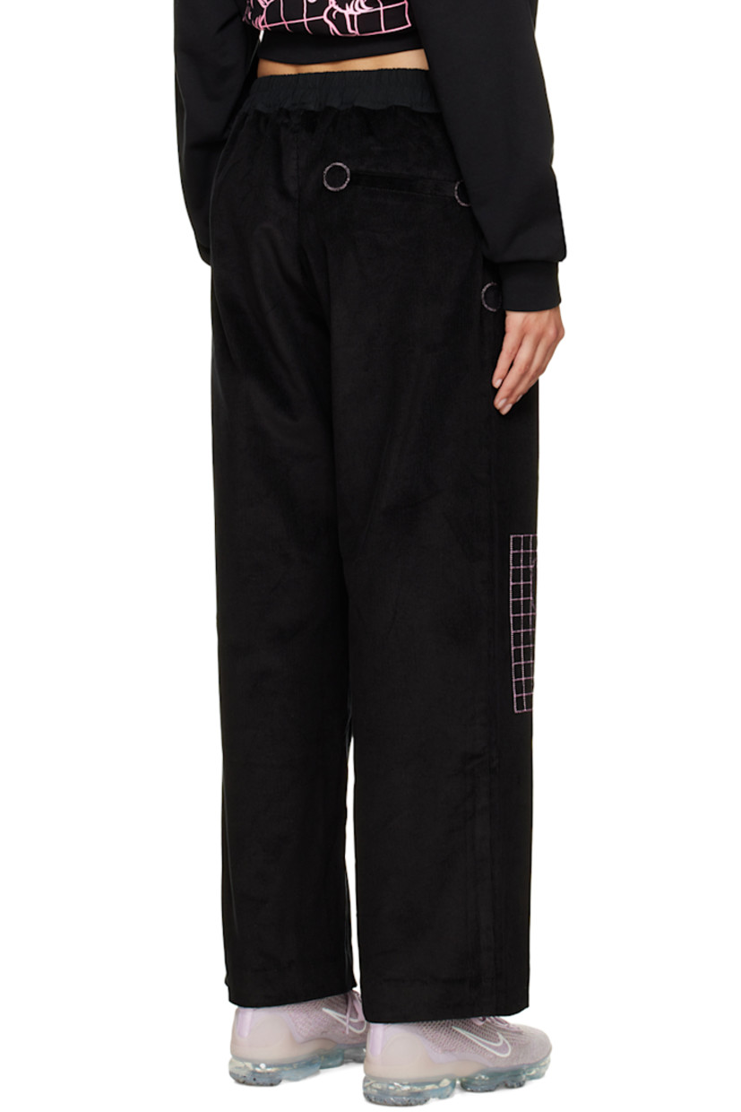 Wide-leg stretch cotton corduroy lounge pants. 

· Drawstring at elasticized waistband
· Three-pocket stylng
· Button-fly
· Graphics embroidered at front

Supplier color: Black
