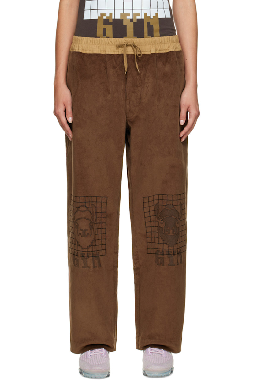 Wide-leg stretch cotton corduroy lounge pants. 

· Drawstring at elasticized waistband
· Three-pocket stylng
· Button-fly
· Graphics embroidered at front

Supplier color: Brown