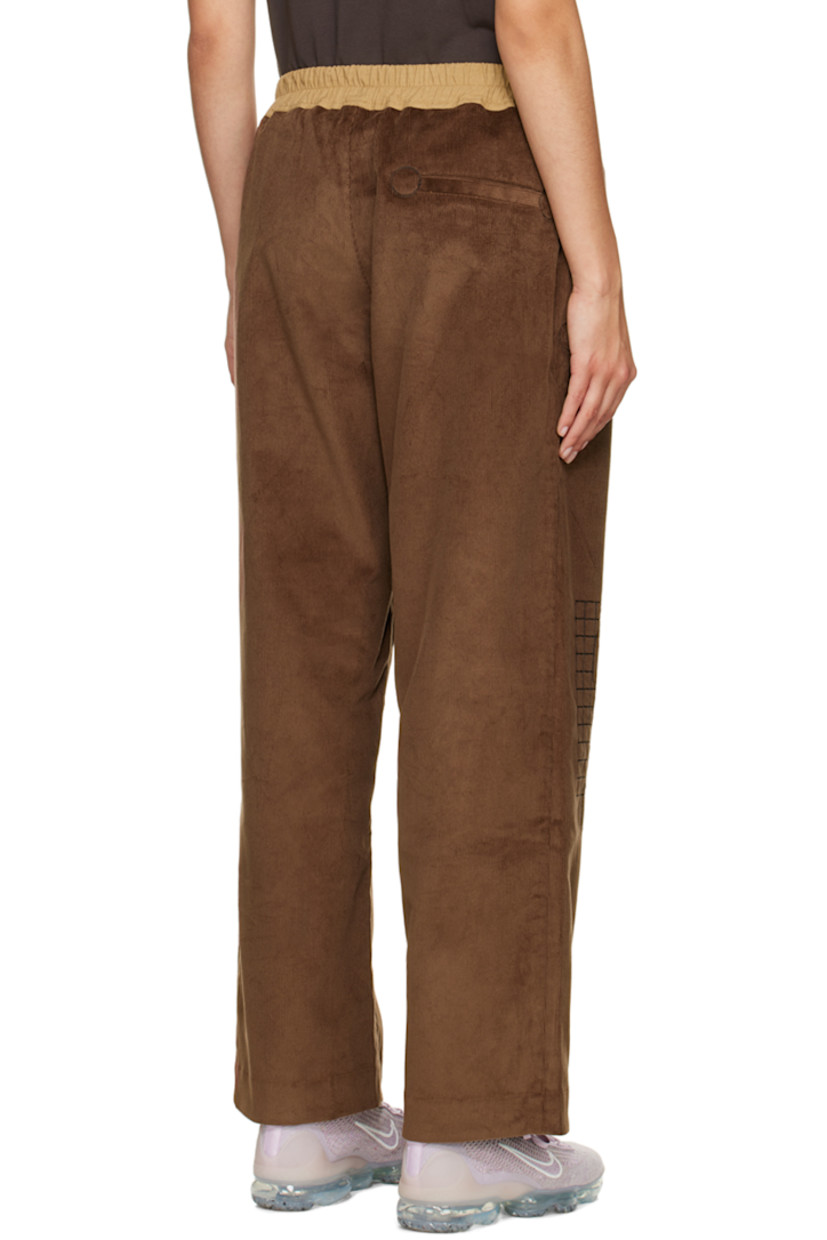 Wide-leg stretch cotton corduroy lounge pants. 

· Drawstring at elasticized waistband
· Three-pocket stylng
· Button-fly
· Graphics embroidered at front

Supplier color: Brown