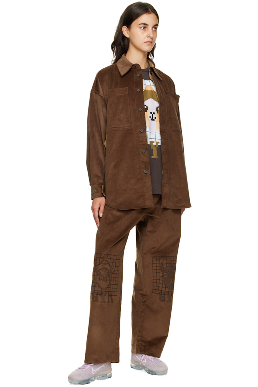 Wide-leg stretch cotton corduroy lounge pants. 

· Drawstring at elasticized waistband
· Three-pocket stylng
· Button-fly
· Graphics embroidered at front

Supplier color: Brown
