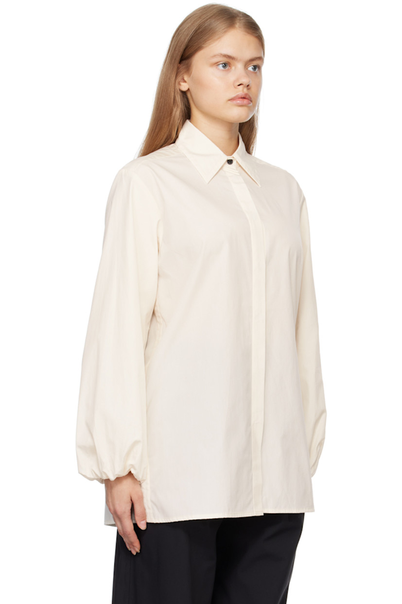 Organic cotton-blend poplin shirt. 

· Spread collar 
· Concealed button closure 
· Elasticized cuffs
· Box pleat at back 

Supplier color: Crema