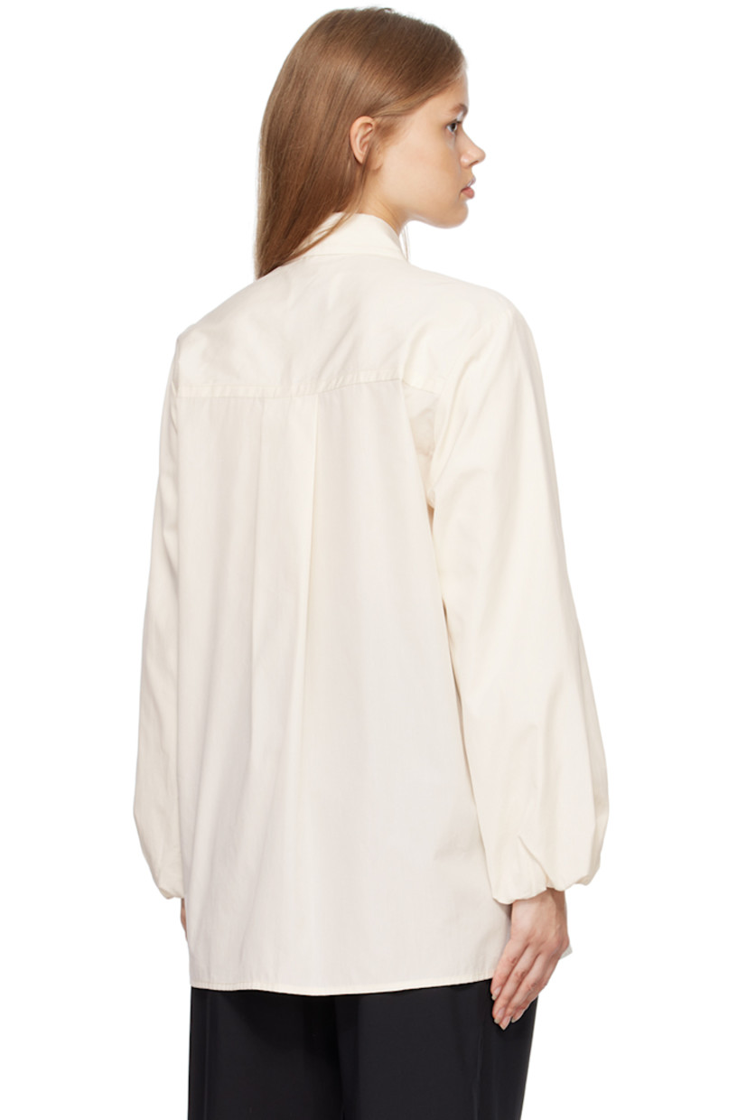 Organic cotton-blend poplin shirt. 

· Spread collar 
· Concealed button closure 
· Elasticized cuffs
· Box pleat at back 

Supplier color: Crema