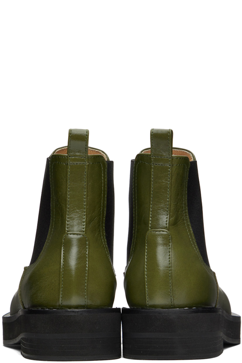 Ankle-high buffed leather boots in khaki. 

· Pull-loop at heel collar
· Elasticized gusset at sides
· Topstitching at welt
· Foam rubber midsole
· Rubber outsole

Wholesale exclusivity at SSENSE.

Supplier color: Khaki