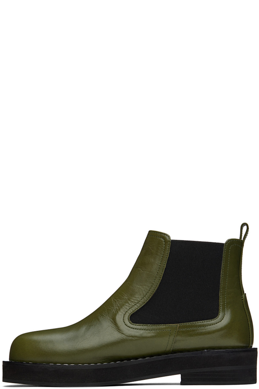 Ankle-high buffed leather boots in khaki. 

· Pull-loop at heel collar
· Elasticized gusset at sides
· Topstitching at welt
· Foam rubber midsole
· Rubber outsole

Wholesale exclusivity at SSENSE.

Supplier color: Khaki