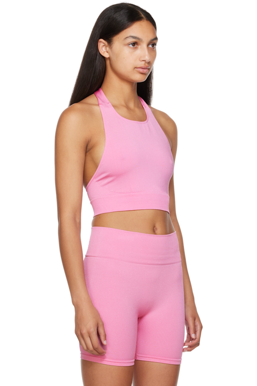 Sweat-wicking, chlorine-resistant, and quick-drying stretch nylon jersey sport top. 

· Self-tie fastening at halter neck
· Low back
· Elasticized rib knit cropped hem

Supplier color: Bubblegum

Size 1 is equivalent to US 2-12
Size 2 is equivalent to US 14-20