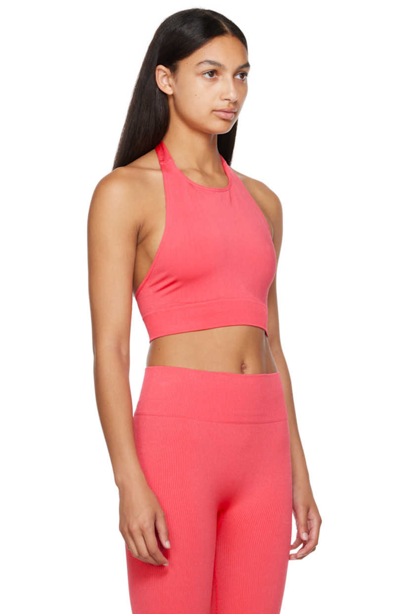 Sweat-wicking, chlorine-resistant, and quick-drying stretch nylon jersey sport top. 

· Crewneck
· Self-tie fastening at halter neck
· Low back
· Elasticized rib knit cropped hem

Supplier color: Cerise

Size 1 is equivalent to US 2-12
Size 2 is equivalent to US 14-20