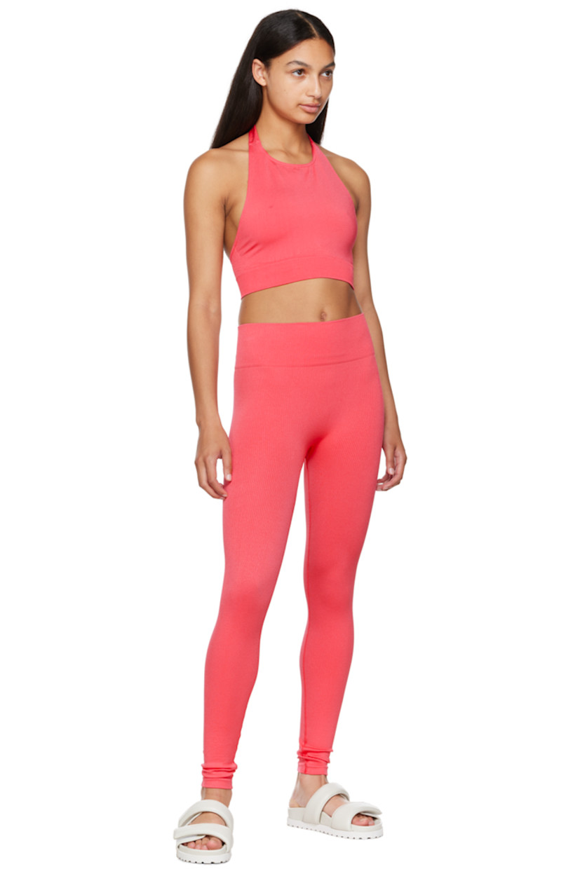 Sweat-wicking, chlorine-resistant, and quick-drying stretch nylon jersey sport top. 

· Crewneck
· Self-tie fastening at halter neck
· Low back
· Elasticized rib knit cropped hem

Supplier color: Cerise

Size 1 is equivalent to US 2-12
Size 2 is equivalent to US 14-20