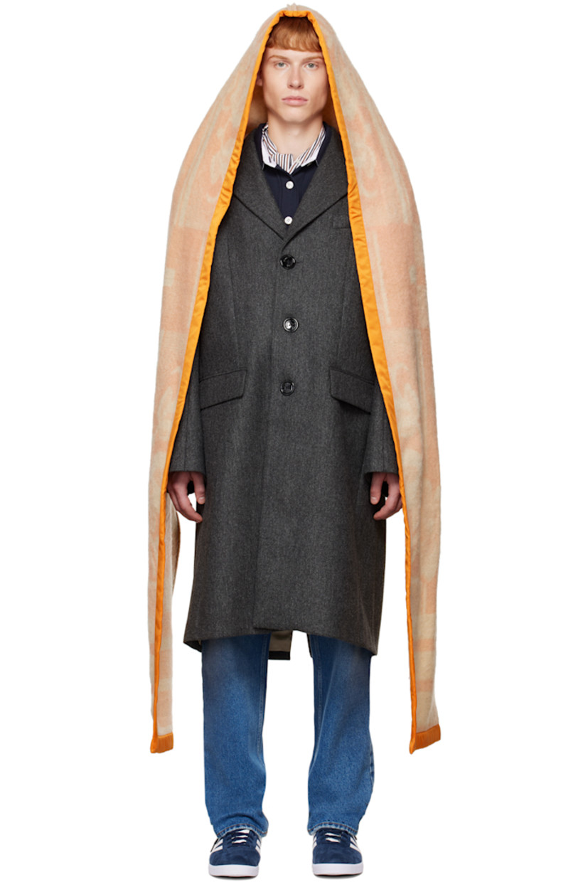 Wool twill coat. 

· Layered construction
· Satin trim at detachable hood
· Notched lapel
· Button closure
· Welt pocket and flap pockets
· Darts at front and back
· Three-button surgeon's cuffs
· Hardware at back
· Central vent at back hem
· Full satin lining
· Logo-engraved horn and corozo hardware

Supplier color: Grey melange