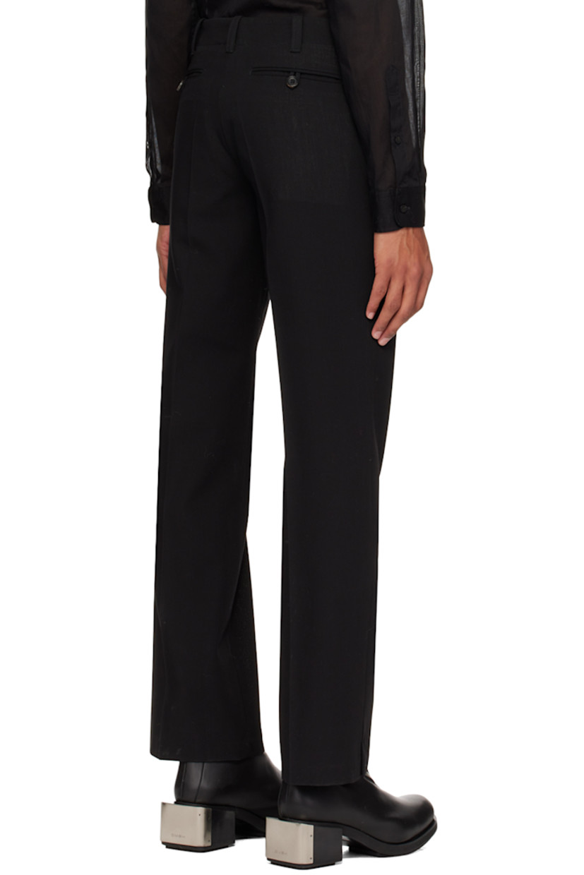 Virgin wool delaine trousers.

· Belt loops
· Five-pocket styling
· Zip-fly
· Creased legs
· Partial plain-woven cotton and satin lining

Available exclusively at SSENSE.

Supplier color: Black