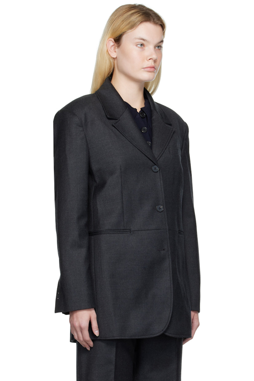 Stretch wool flannel blazer.

· Notched lapel
· Three-button closure
· Welt pocket, darts, and welt pockets
· Padded shoulders
· Four-button surgeon's cuffs
· Central vent at back hem
· Full  bemberg-blend satin lining

Supplier color: Gray