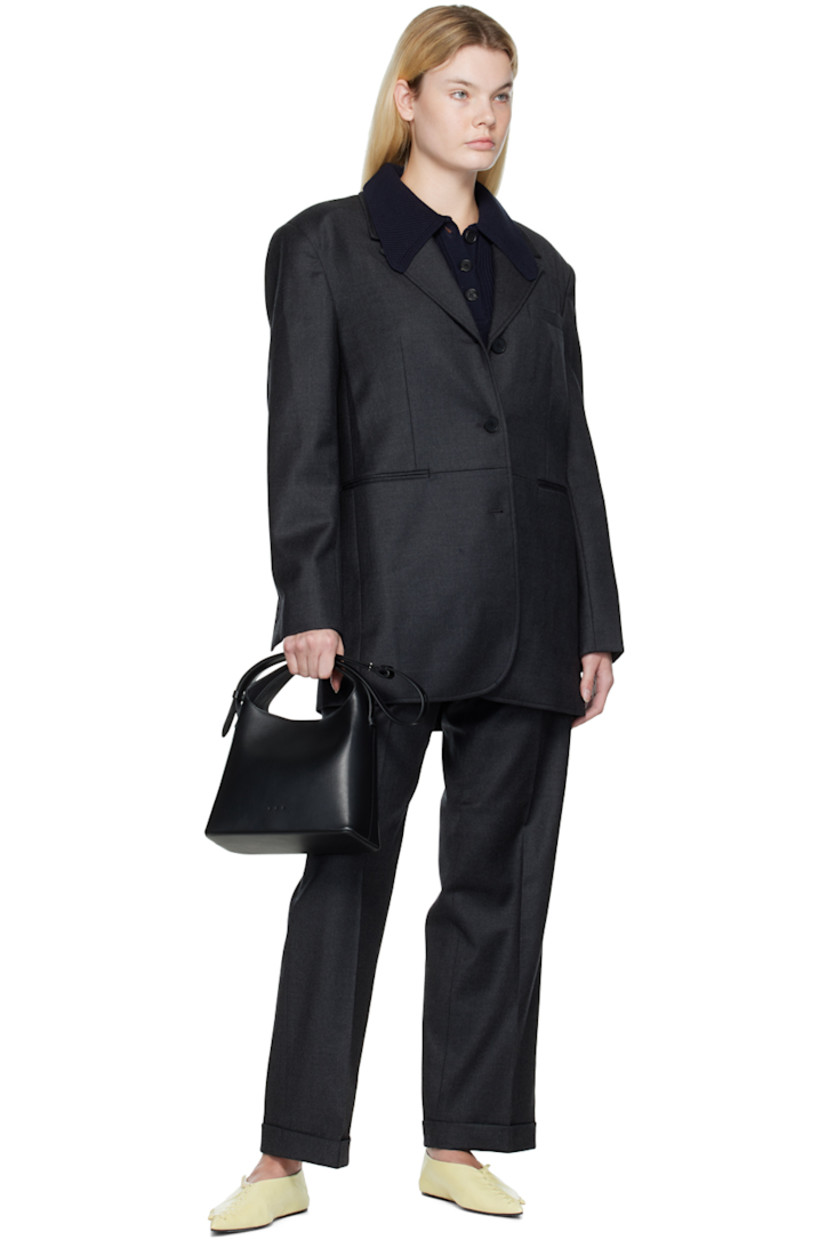 Stretch wool flannel blazer.

· Notched lapel
· Three-button closure
· Welt pocket, darts, and welt pockets
· Padded shoulders
· Four-button surgeon's cuffs
· Central vent at back hem
· Full  bemberg-blend satin lining

Supplier color: Gray