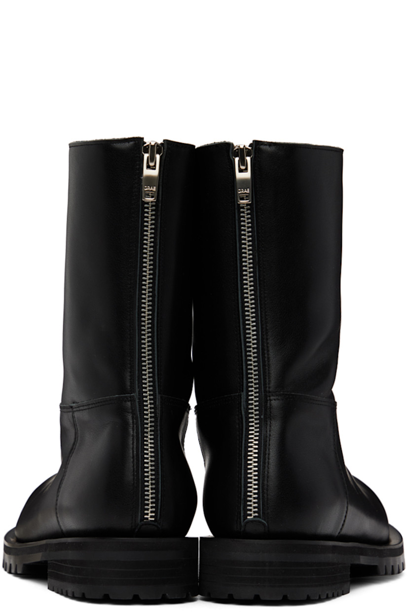 Ankle-high paneled buffed kip leather boots in black.

· Zip closure at heel counter
· Shearling and leather lining
· Stacked block heel
· Treaded rubber sole
· Heel: H1.2 in

Available exclusively at SSENSE.

Supplier color: Black
