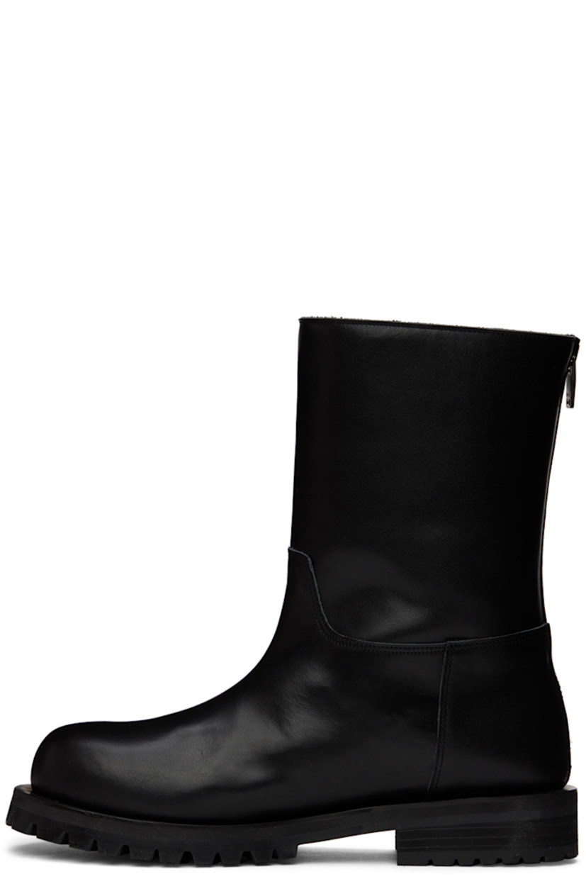 Ankle-high paneled buffed kip leather boots in black.

· Zip closure at heel counter
· Shearling and leather lining
· Stacked block heel
· Treaded rubber sole
· Heel: H1.2 in

Available exclusively at SSENSE.

Supplier color: Black