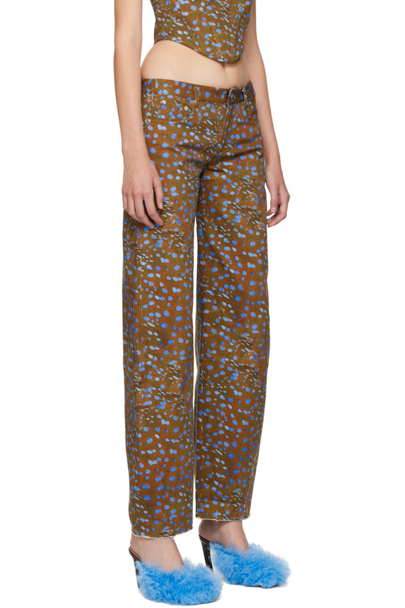 Wide-leg non-stretch denim jeans. Graphic pattern printed throughout. 

· Low-rise
· Belt loops
· Five-pocket styling
· Zip-fly
· Logo graphics embroidered at back 
· Contrast stitching in black

Supplier color: Stingray