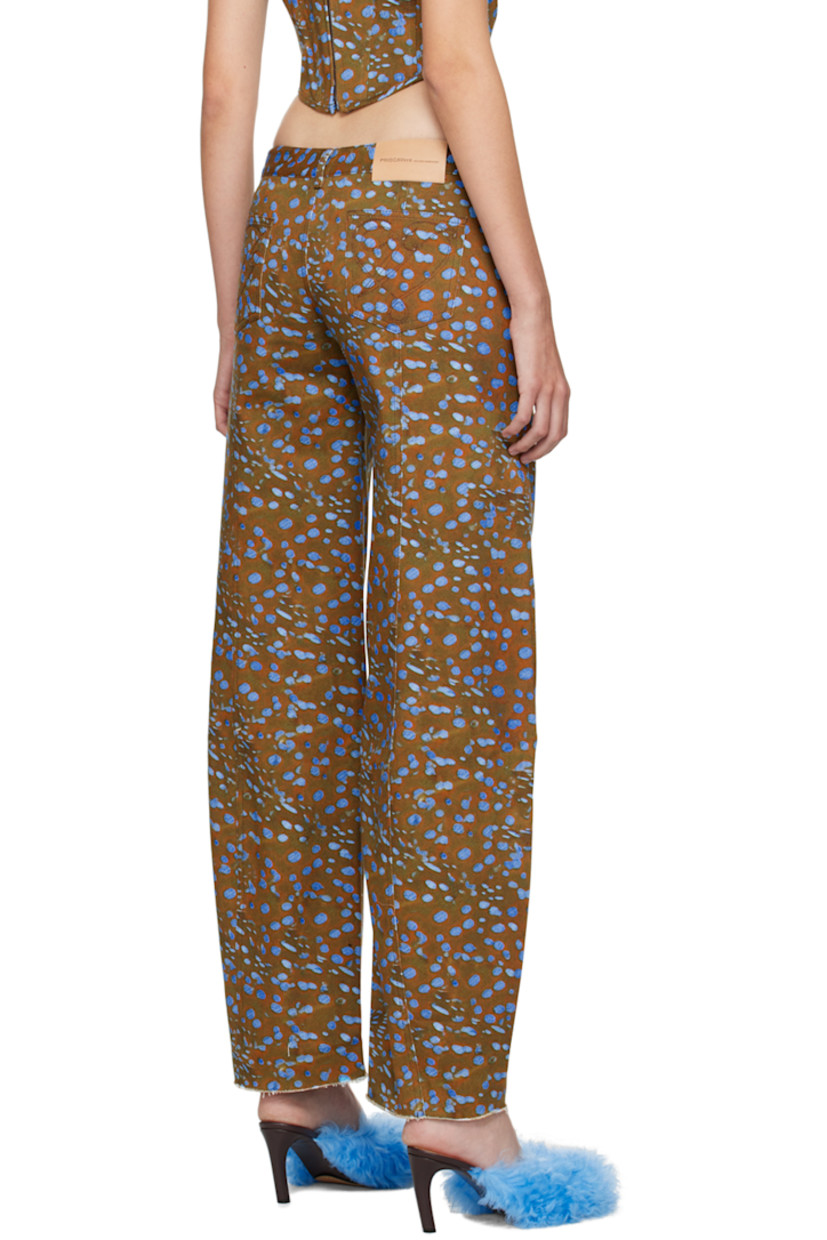 Wide-leg non-stretch denim jeans. Graphic pattern printed throughout. 

· Low-rise
· Belt loops
· Five-pocket styling
· Zip-fly
· Logo graphics embroidered at back 
· Contrast stitching in black

Supplier color: Stingray