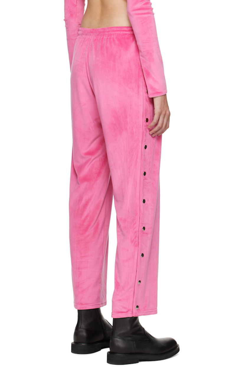 Stretch polyester velour lounge pants. 

· Drawstring at elasticized waistband
· Two-pocket styling
· Pinched seam at legs
· Press-stud vent at cuffs

Supplier color: Hot pink