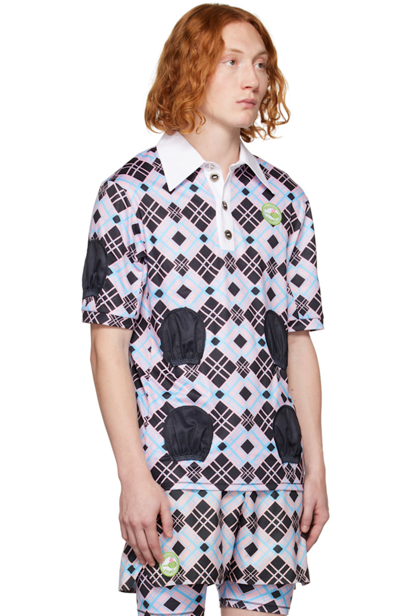 Stretch polyester jersey polo. Check pattern throughout.

· Spread collar
· Four-button placket
· Textile logo patch at chest
· Pocket-style accents at front and sleeves

Supplier color: Multi
