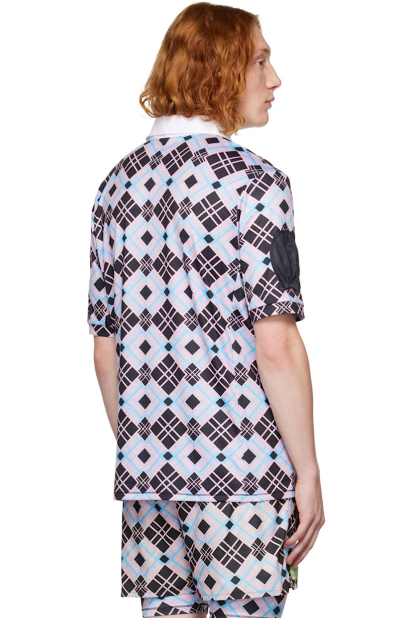 Stretch polyester jersey polo. Check pattern throughout.

· Spread collar
· Four-button placket
· Textile logo patch at chest
· Pocket-style accents at front and sleeves

Supplier color: Multi