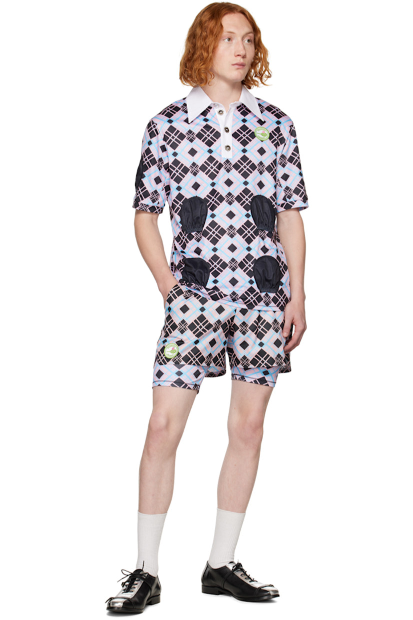 Stretch polyester jersey polo. Check pattern throughout.

· Spread collar
· Four-button placket
· Textile logo patch at chest
· Pocket-style accents at front and sleeves

Supplier color: Multi