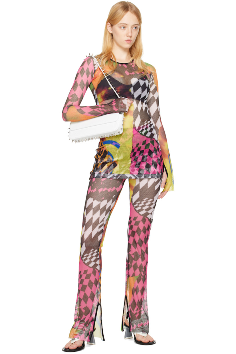 Stretch recycled polyester mesh blouse. Graphic pattern printed throughout.

· Crewneck
· Raw edge at hem and cuffs
· Thumbhole at cuffs

Supplier color: Rave poster print