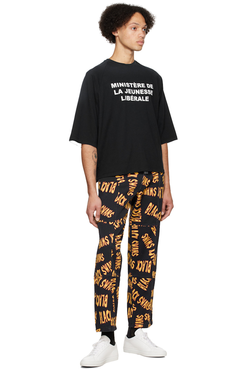 Non-stretch denim jeans. Text printed throughout.

· Paneled construction
· Belt loops
· Five-pocket styling
· Zip-fly
· Logo patch at front and back waistband
· Contrast stitching in tan

Supplier color: Black