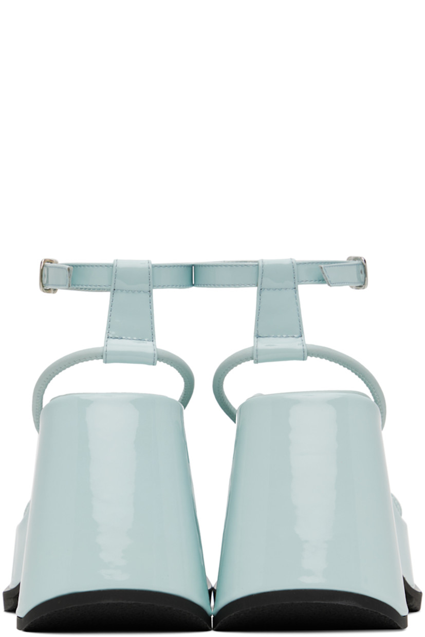 Patent leather heels in blue. 

· Open square toe
· Adjustable pin-buckle ankle strap
· Textile logo patch at padded footbed 
· Covered platform midsole and block heel 
· Treaded rubber outsole
· Heel: H3.75 in
· Platform: H1.5 in

Wholesale exclusivity at SSENSE.

Supplier color: Opal