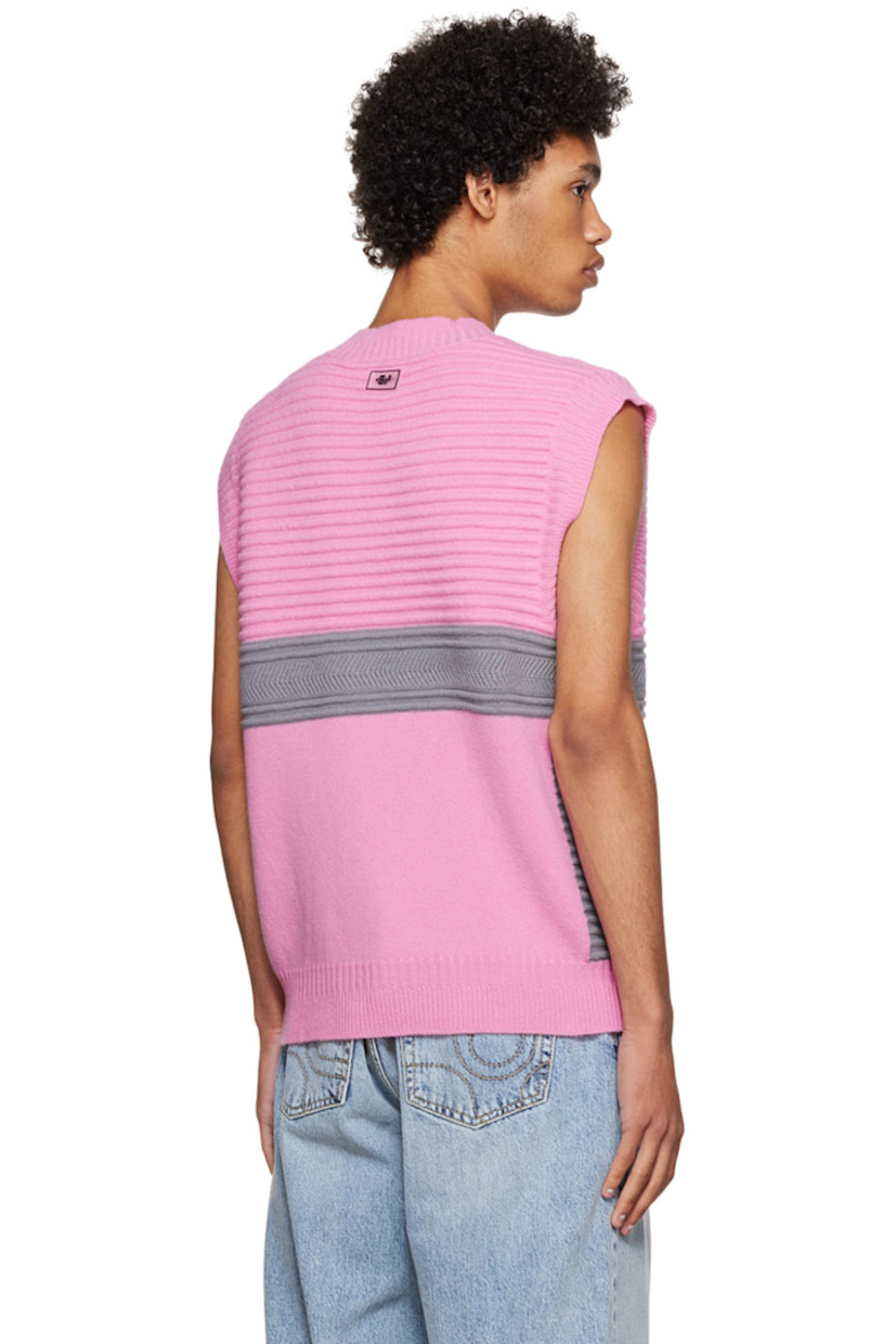 Knit merino wool vest.

· Rib knit V-neck, armscyes, and hem
· Rubberized logo patch at back

Available exclusively at SSENSE.

Supplier color: Pink lemonade