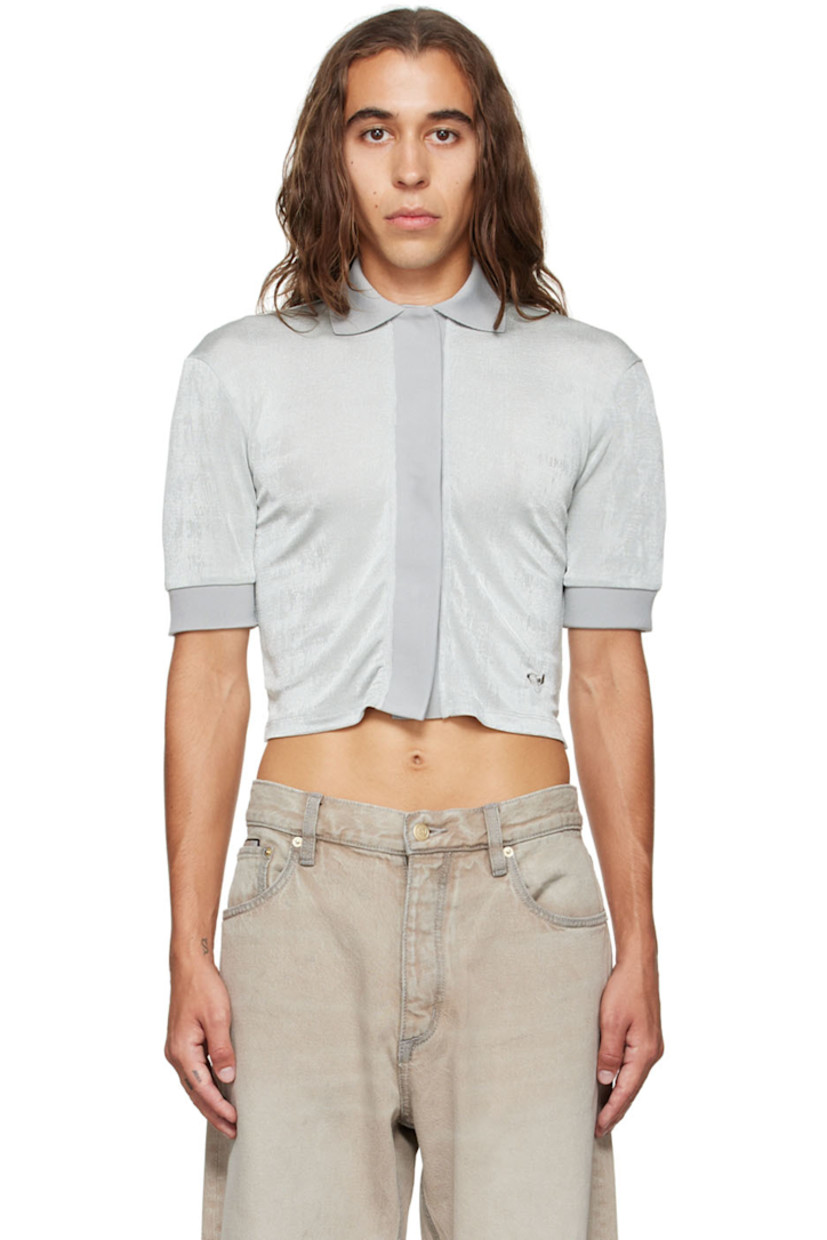 Stretch polyester jersey polo.

· Rib knit spread collar and cuffs
· Concealed press-stud closure
· Logo embroidered at front hem

Supplier color: Oyster