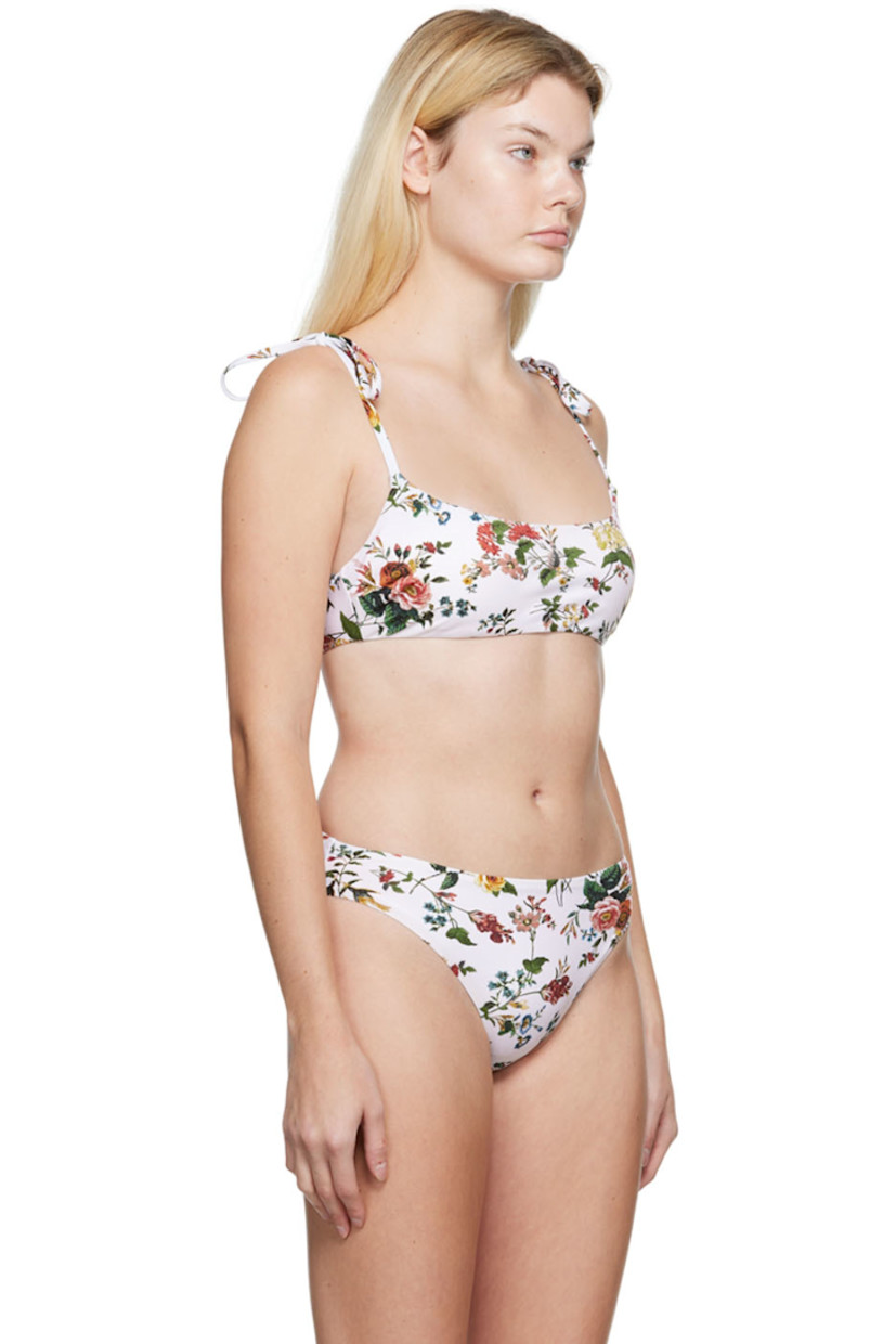 Stretch nylon jersey bikini top. Graphic pattern printed throughout.

· Self-tie shoulder straps
· Scoop neck
· Tab-slot fastening at back
· Full jersey lining

Supplier color: White