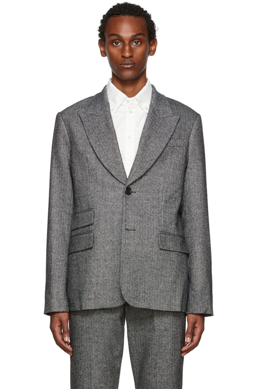 Wool-blend herringbone blazer. 

· Notched lapel
· Single-breasted button closure 
· Flap pockets 
· Four-button surgeon's cuffs 
· Central vent at back hem 
· Full satin lining 

Supplier color: Black