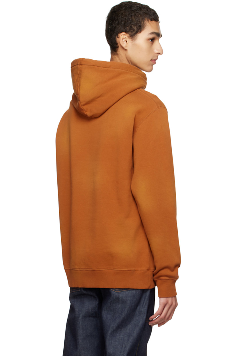 Organic cotton fleece hoodie. Fading throughout.

· Drawstring at hood
· Embroidered logo patch at chest
· Kangaroo pocket
· Rib knit hem and cuffs

Supplier color: Spray brown
