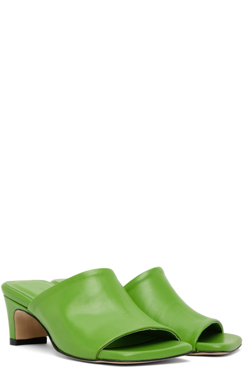 Buffed leather heeled sandals in green.

· Open square toe
· Logo embossed at padded leather footbed 
· Covered block heel with rubber injection
· Leather sole in beige
· Heel: H2 in

Supplier color: Green