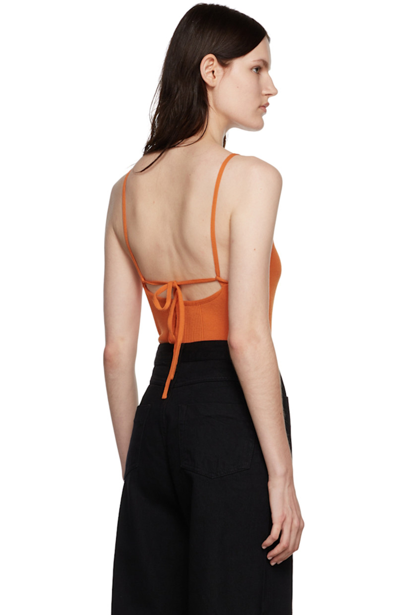 Rib knit rayon-blend bodysuit. 

· Self-tie halter neck
· Press-stud fastening at bottom

Supplier color: Orange