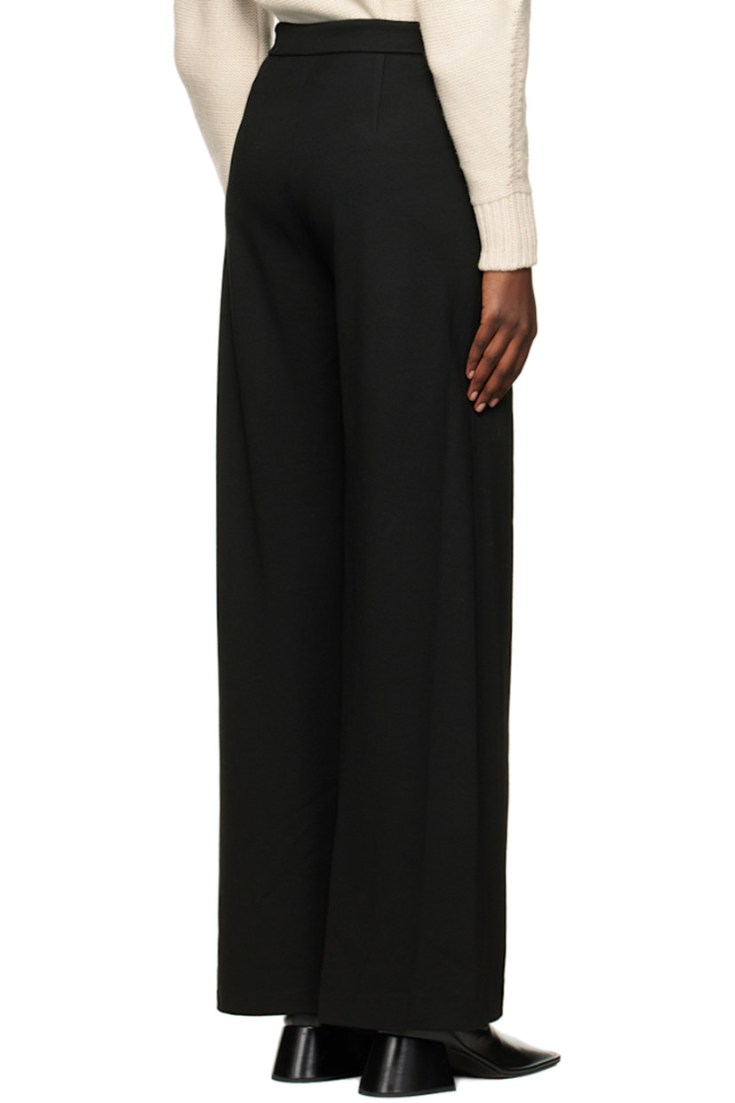 Knit stretch viscose trousers.

· Wrap construction
· Belt loops
· Two-pocket styling
· Pleat at front
· Partial viscose satin lining

Supplier color: Black