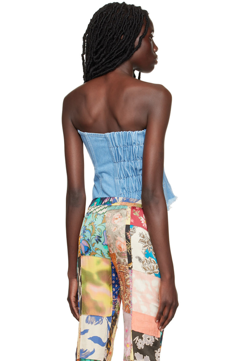 Paneled non-stretch REFIBRA™ cotton and recycled cotton-blend corset.

· Strapless construction 
· Straight neck 
· Offset press-stud closure
· Elasticized shirring at back 
· Frayed edge at hem 
· Unlined 

Supplier color: Blue